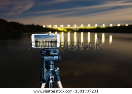Using smartphone like professional camera on tripod to capturing night landscape