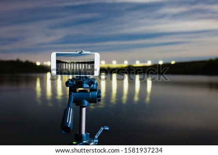 Using smartphone like professional camera on tripod to capturing night landscape