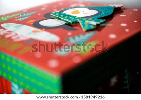Christmas gift box with penguin embellishment

