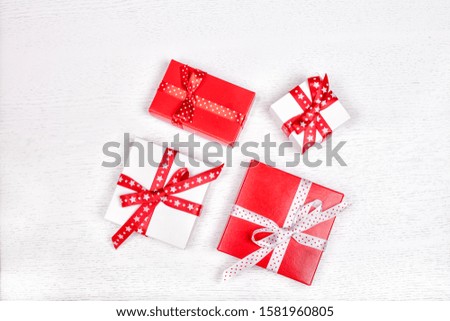  present boxes with ribbons on white background