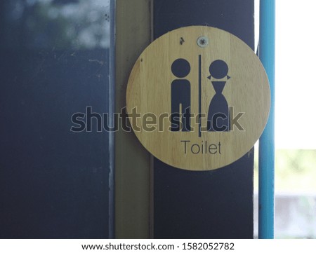 Concept wood sign of toilet room at the cafe