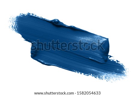 Classic blue lipstick smear smudge isolated on white background. Trendy color makeup swatch Royalty-Free Stock Photo #1582054633