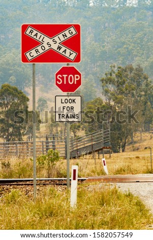 Railway crossing warning signs in rural Australia.