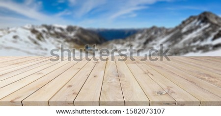 wooden table of free space and winter landscape
