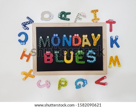 "Monday Blues" alphabet decoration words on the chalkboard.