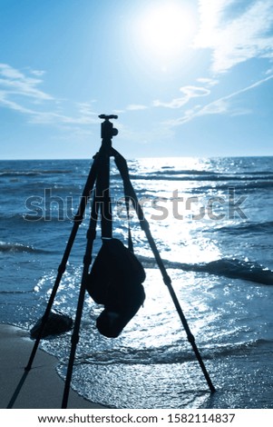 The tools of the photographer left behind on the beach on Lake Michigan