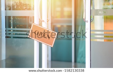 open sign door glass in the shop / business sign open come hang in cafe restaurant door slide