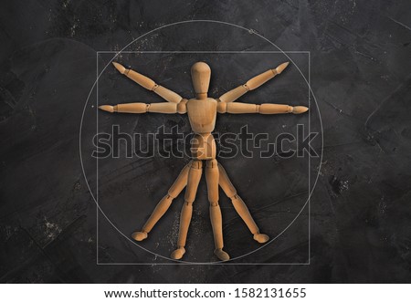 wooden mannequin  on black concrete wall