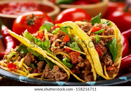 plate of tacos on wooden table