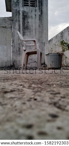 old chair on roof with beautiful background 