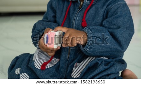 Cute  little asian  baby boy playing toy car