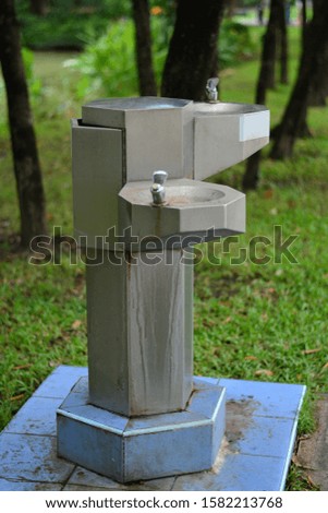 Water tap in the park made of stainless steel