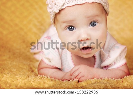 cute happy baby portrait with big eyes