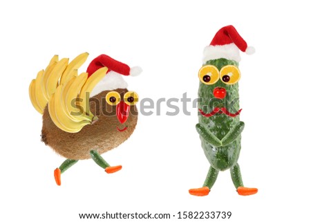 Creative food concept. Funny vegetables and fruits as a Santa Clauses. Happy New Year.