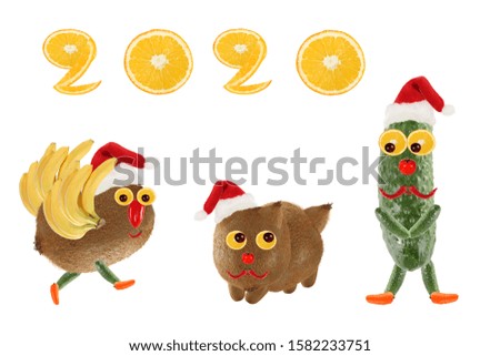 Creative food concept. Funny vegetables and fruits. Happy New Year 2020.