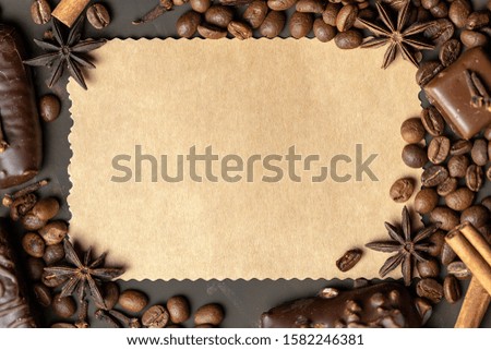Appetizing food background. Sweets, coffee and spices around the card for notes.