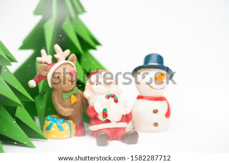 Set of cartoon miniature Christmas isolated on white.Funny happy Santa Claus, Reindeer and snowman on christmas tree with snowflakes ready for season.For Christmas cards, banners and background.