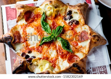 Pizza. Cheese pizza. Traditional New York City style margarita pizza with a thin homemade crispy crust, fresh tomato garlic marinara sauce topped with buffalo mozzarella cheese and fresh basil leaves.