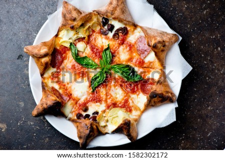 Pizza. Cheese pizza. Traditional New York City style margarita pizza with a thin homemade crispy crust, fresh tomato garlic marinara sauce topped with buffalo mozzarella cheese and fresh basil leaves.