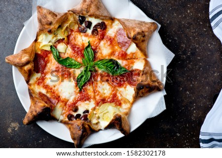 Pizza.Traditional New York City style pizza w/ artichoke, basil and Kalamata olives. Homemade crispy crust w/ fresh tomato marinara sauce topped with buffalo mozzarella cheese, basil, Kalamata olives.