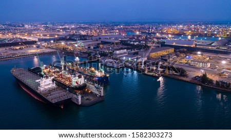 large shipyard and maintenance on the sea at night laem chabang Thailand aerial view Royalty-Free Stock Photo #1582303273
