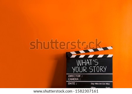 What's your story.text title on film slate Royalty-Free Stock Photo #1582307161