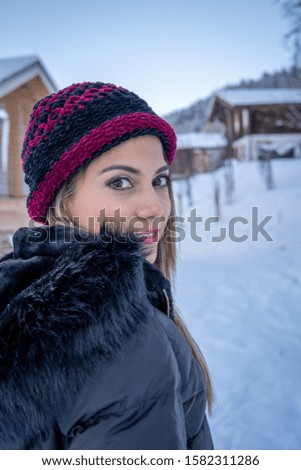 Pictures of a latin woman visiting the snow