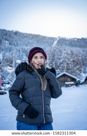 Pictures of a latin woman visiting the snow