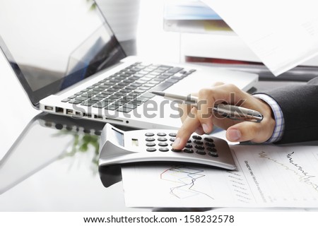 Close-up photo of a businessman analyzing financial data Royalty-Free Stock Photo #158232578