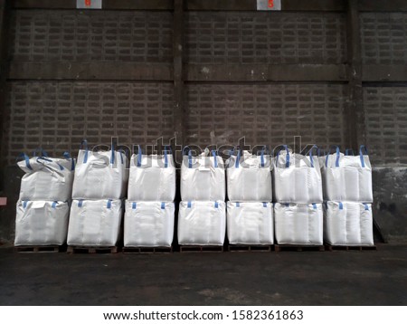 Chemical fertilizer Urea Stock pile jumbo-bag in warehouse waiting for shipment.