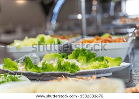 Stock photo of a salad plate at a self-service restaurant counter