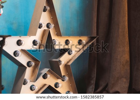 decorative big star in the interior with light bulbs
