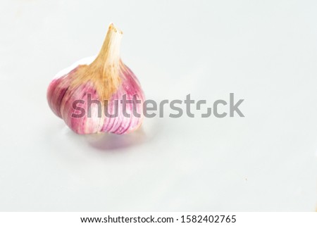 Head of dried blue garlic on a white background.