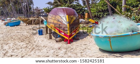 Vietnamese fishing coracles on beach tribal boats at fishing village Mui Ne Beach Vietnam