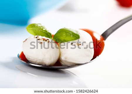 Mozzarella balls with tomatoes and basil