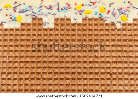 Sweet waffle background with cream. Space for text or design. 