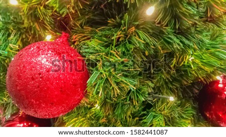 Christmas ornament hanging on Christmas tree with copy space