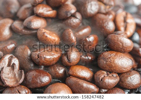 Roasted Coffee bean background with smoke on surface