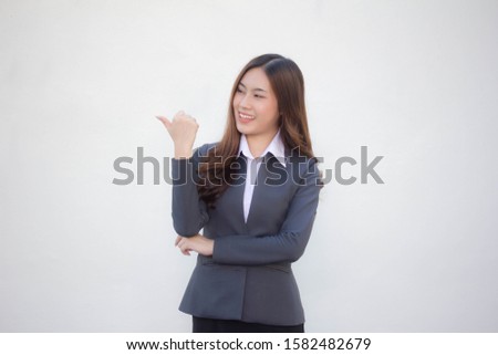 Portrait of thai adult working women white shirt pointing