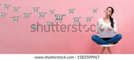 Online shopping with young woman using a laptop computer