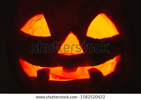 halloween pumpkin face on a black background
