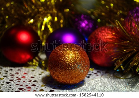 bright colored christmas balls with bokeh close up