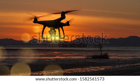 Drone with high resolution digital camera on the sky mountain and sea side background.