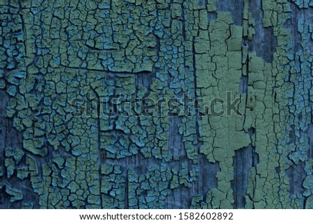 Old blue paint on a wooden Board