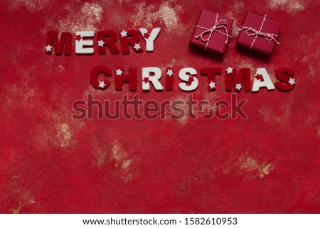 Two gift boxes on Red Lush Lava background. Merry Christmas card