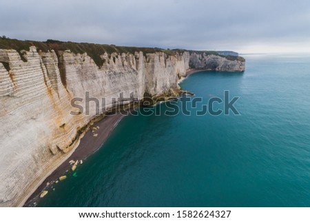 Panoramatic view on Etretat steep rock coastal cliffs at north of France, served as many inspiration for Monet, the impresionist painter