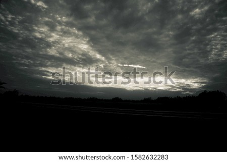 Dark cloudy sky black and white natural photo