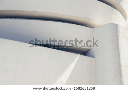 A wide closeup shot of a white abstract architectural building