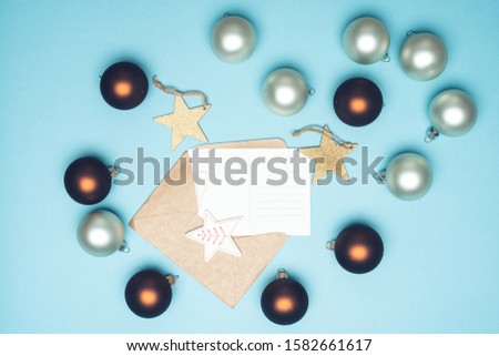 Christmas background with mockup blank greeting card. New Year winter holidays concept. Christmas baubles
