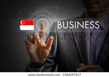 Singapore Business concept. Man pressing virtual button with flag icon